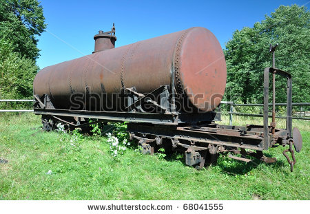 stock-photo-old-rusty-decauville-train-tank-on-the-grass-.jpg